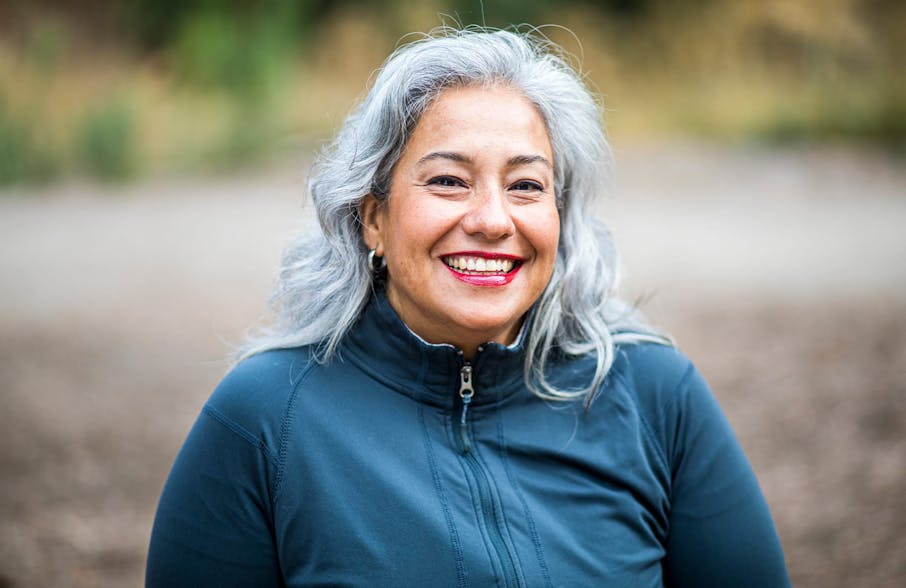 woman with grey hair smiling