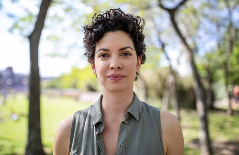 woman with short hair in park