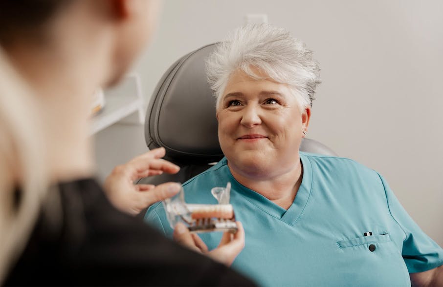 client looking at Dr. Quimby smiling