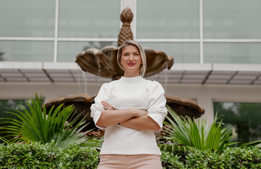Dr. Quimby standing in front of fountain