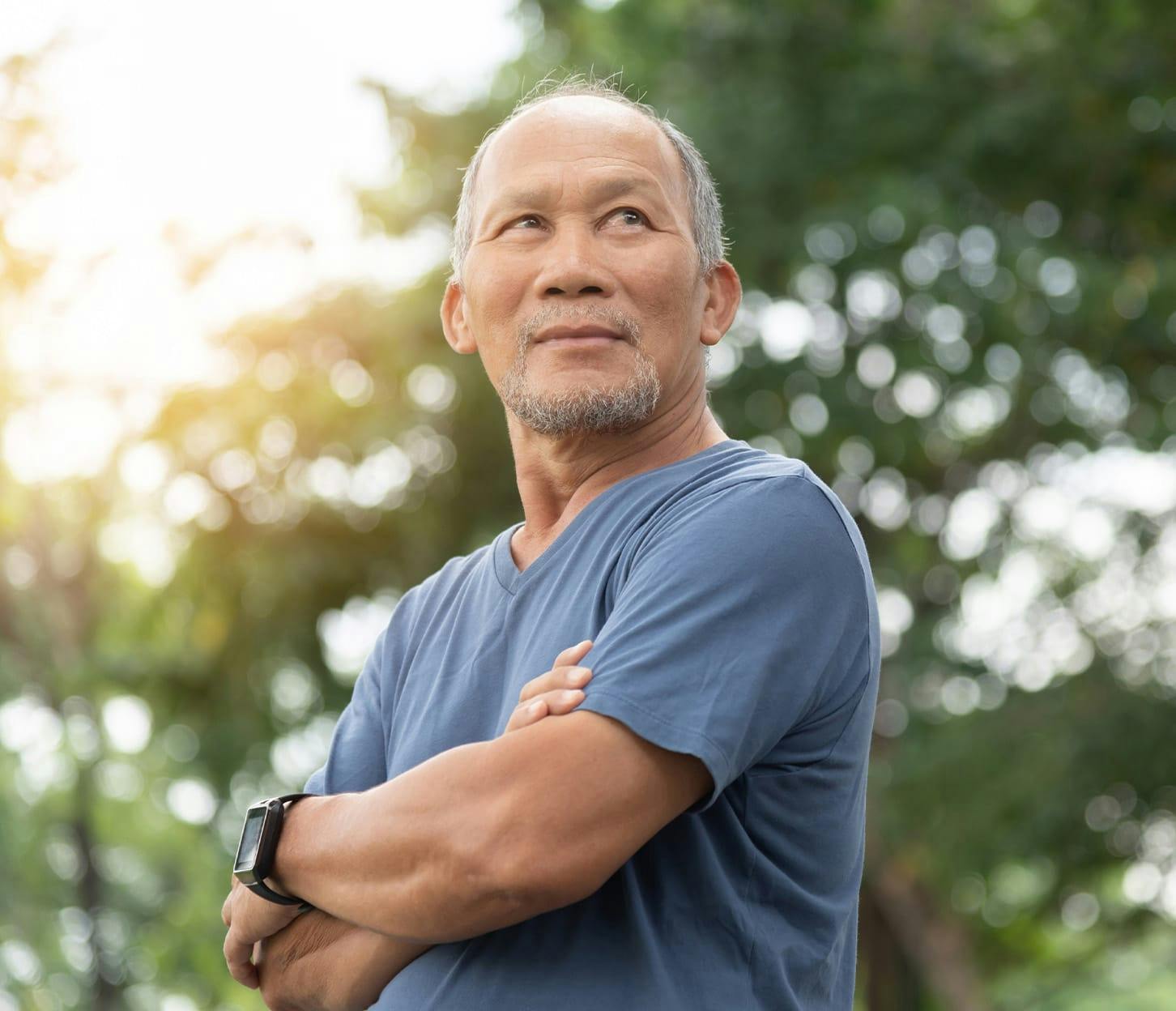 man jogging and crossing his arms