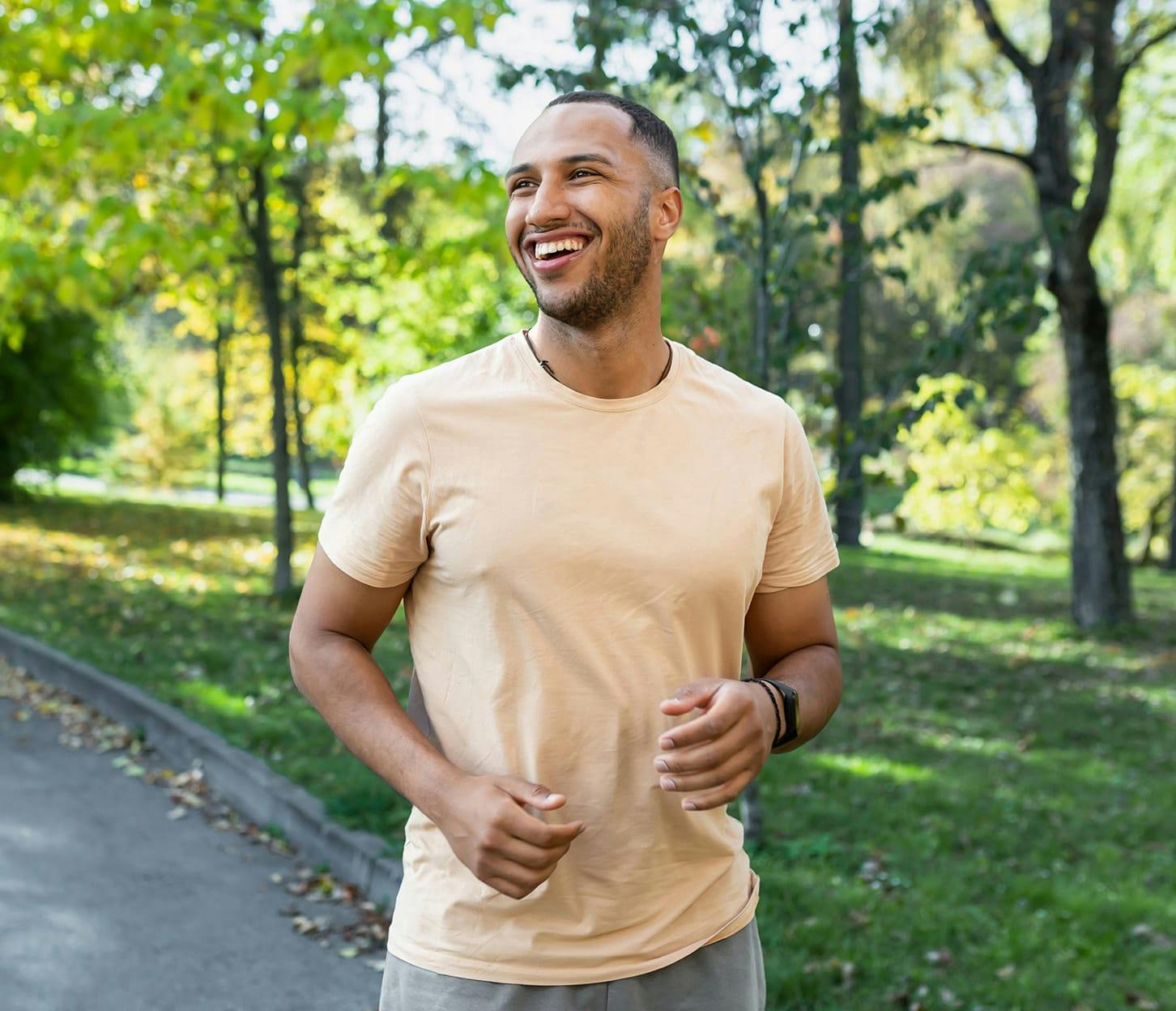 man in peach colored shirt jogging