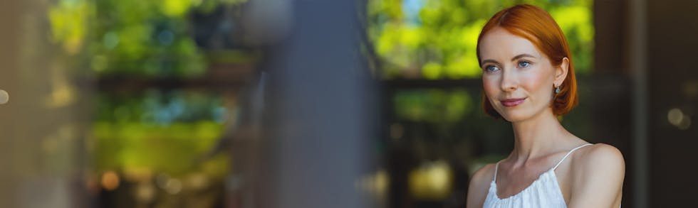 woman in a white dress outside