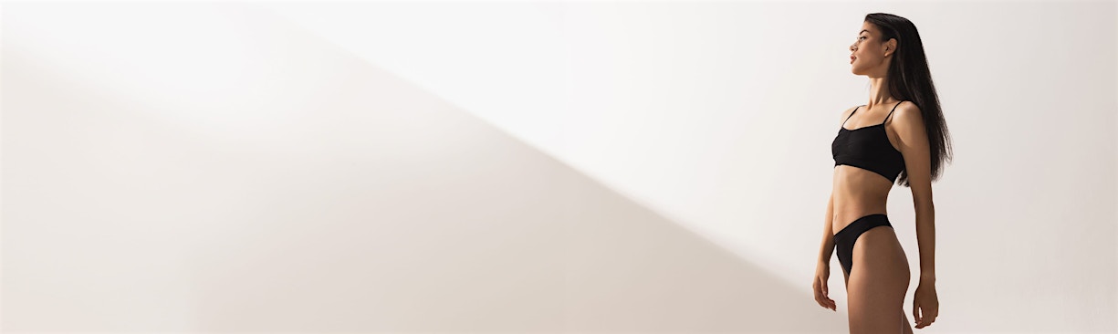 woman posing in black undergarments