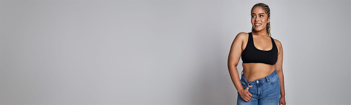 woman with thumb hooked in belt loop