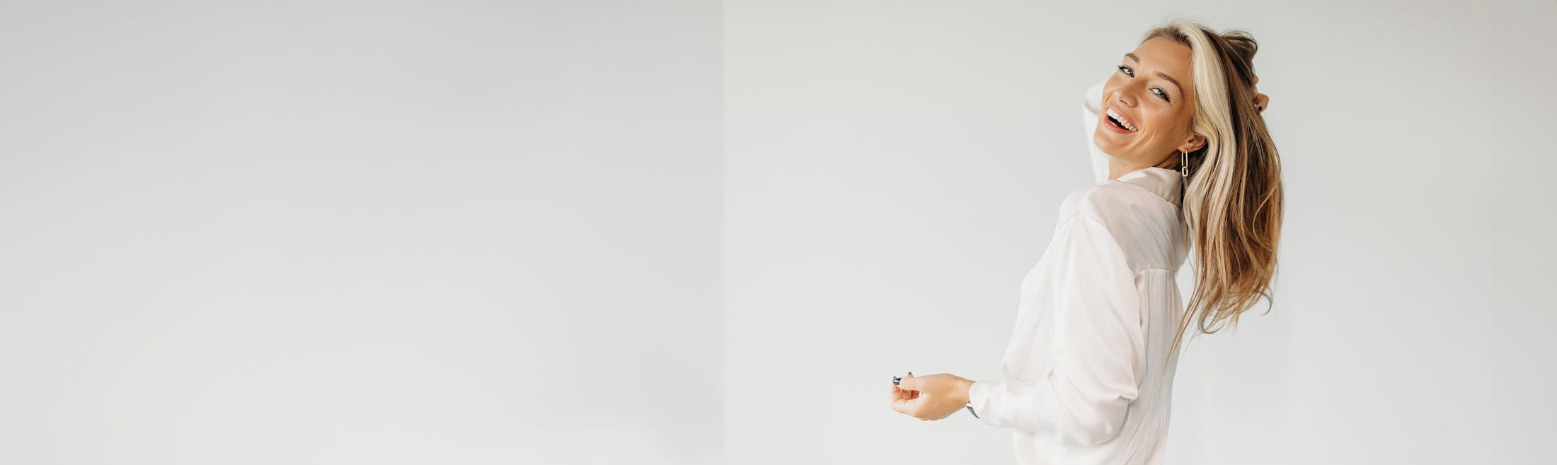 woman laughing and looking over shoulder