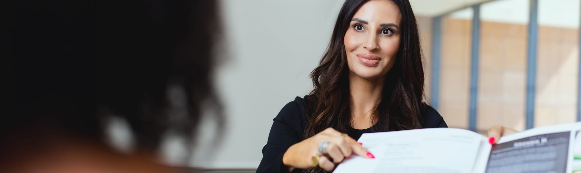 Woman pointing at paper