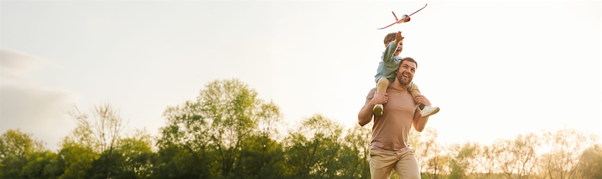 Man with child of his shoulders