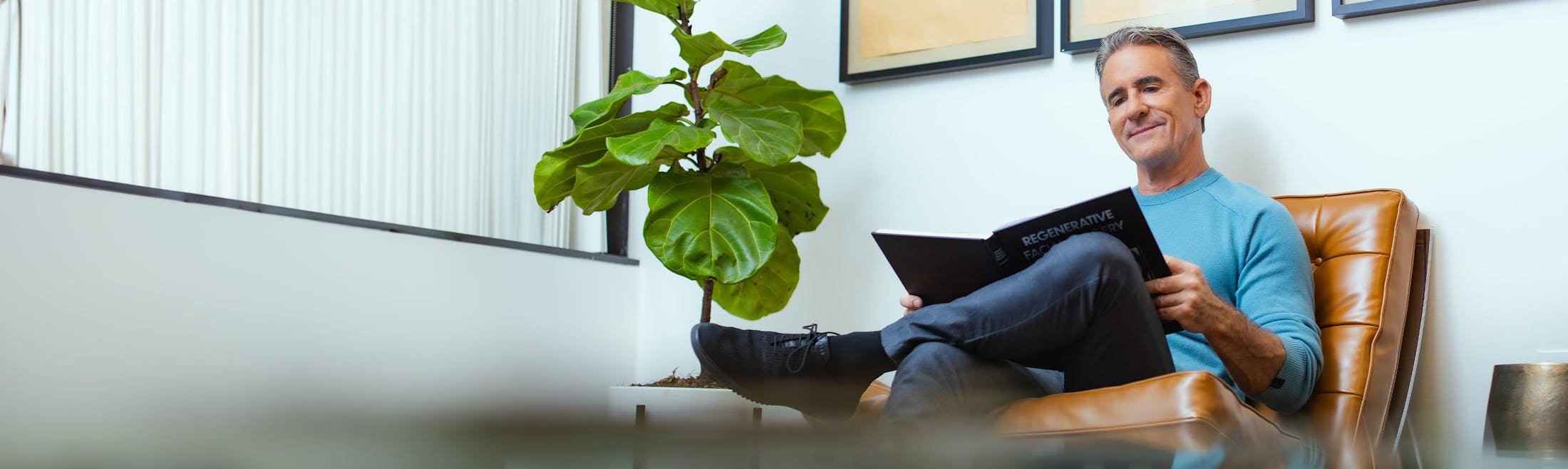 man reading in waiting room