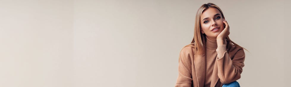 woman resting chin in hand