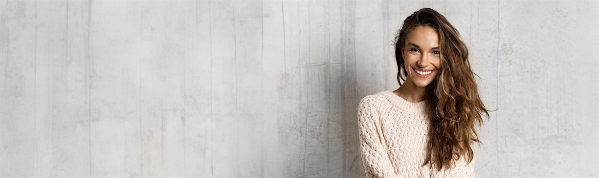 woman in sweater smiling