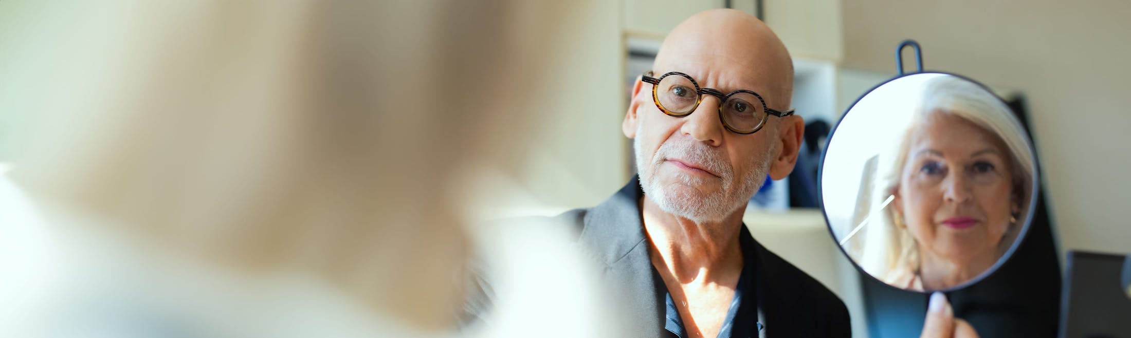 Dr. Cohen showing patient mirror