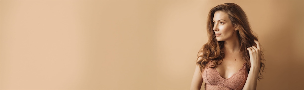 woman posing in tan bra