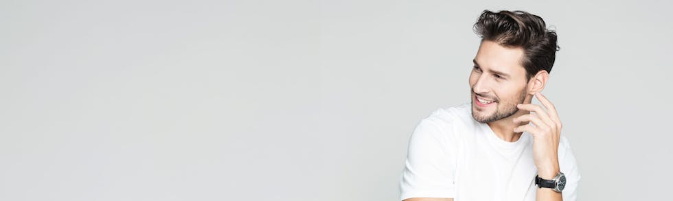 man posing in white shirt