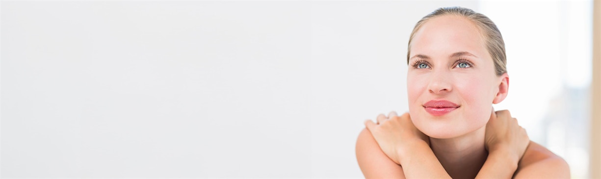 woman crossing arms over chest and shoulders