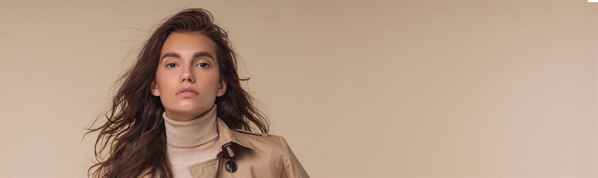 woman in tan turtleneck