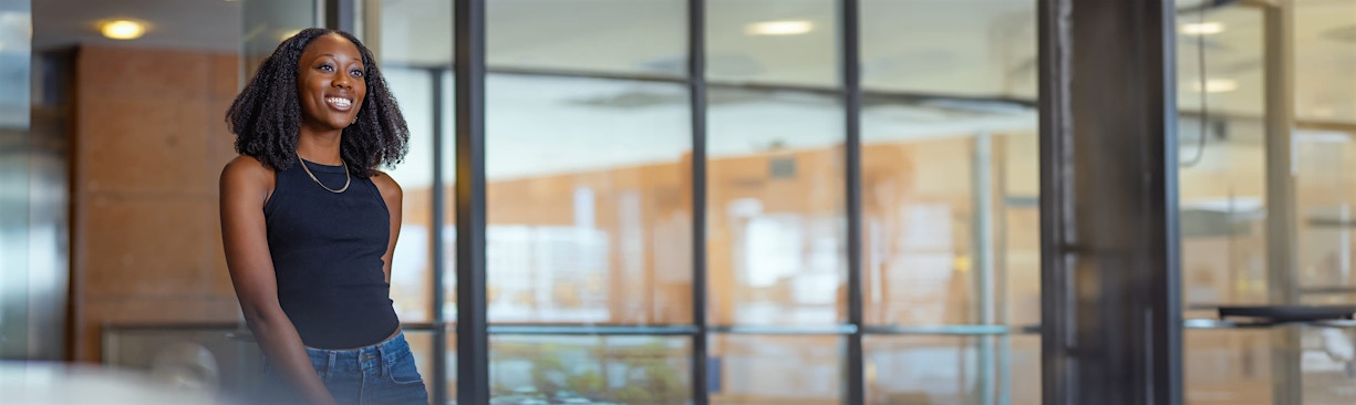 woman entering Faces+ office