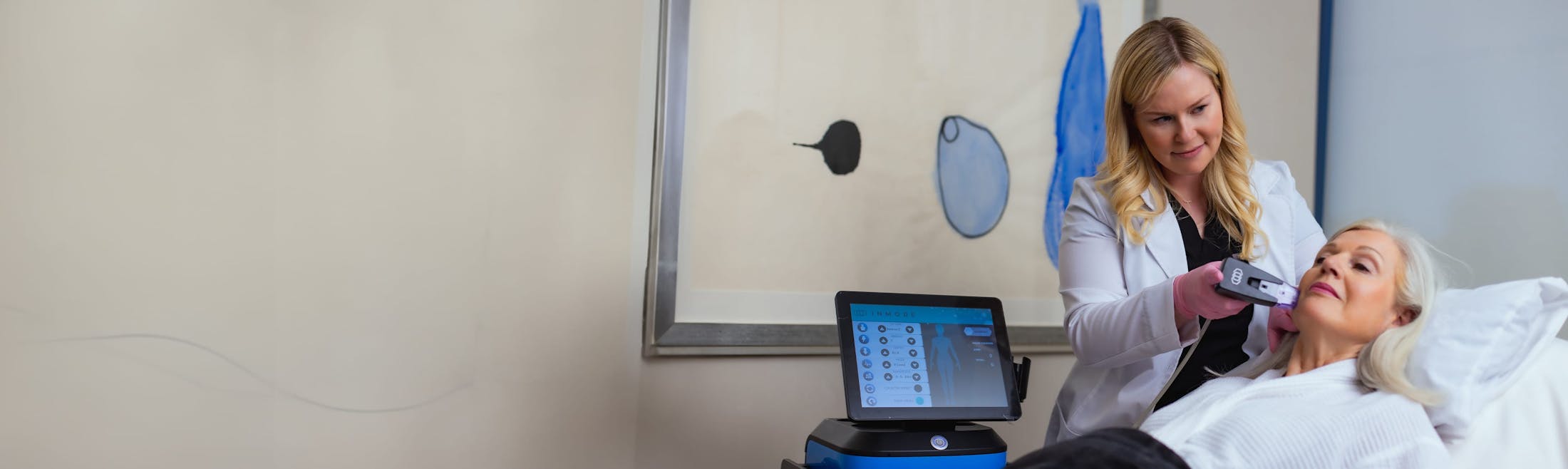 Faces+ practitioner administering facial treatment