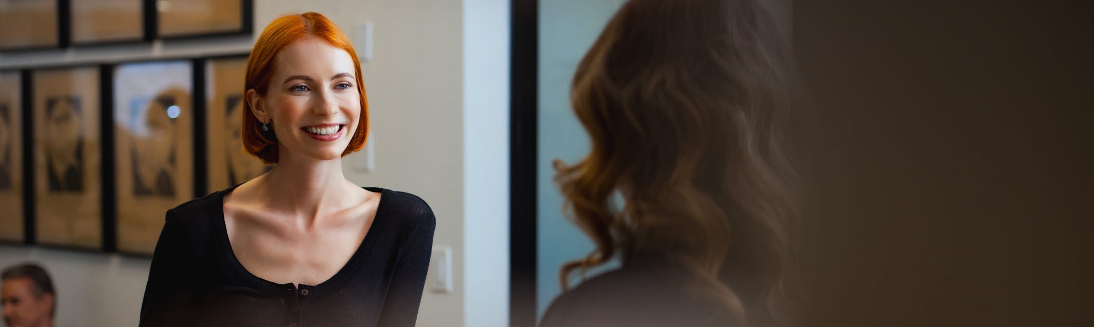 woman speaking with front desk