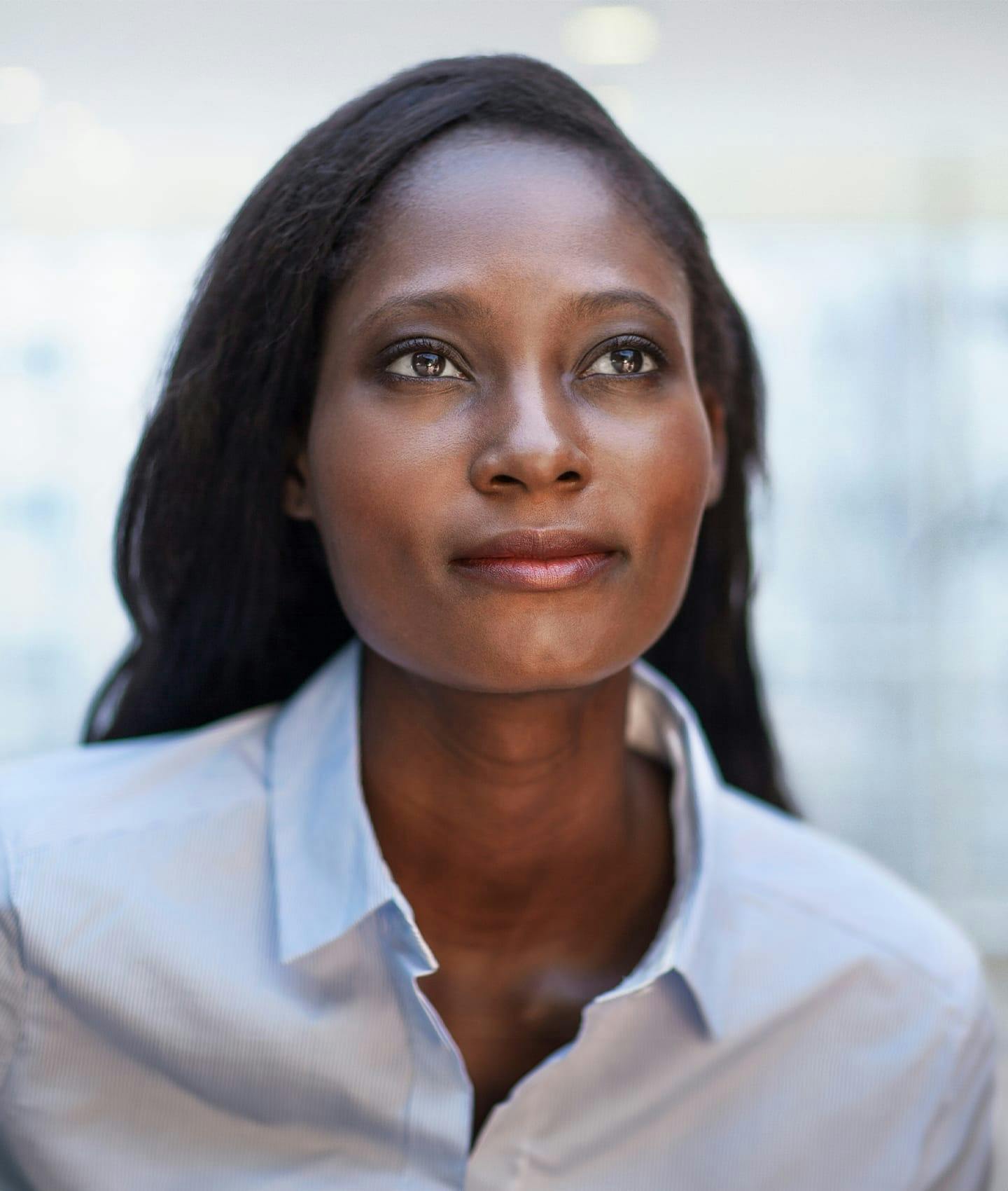 woman of color in blue shirt