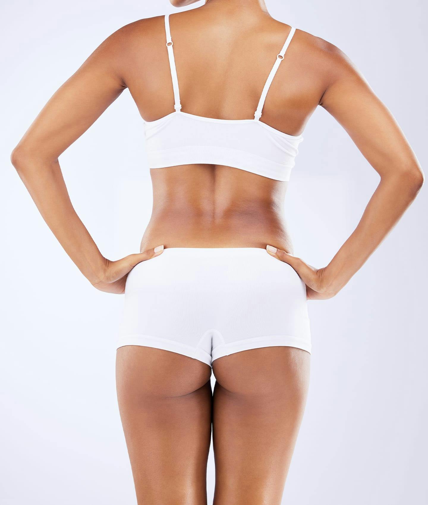 woman's back in white undergarments