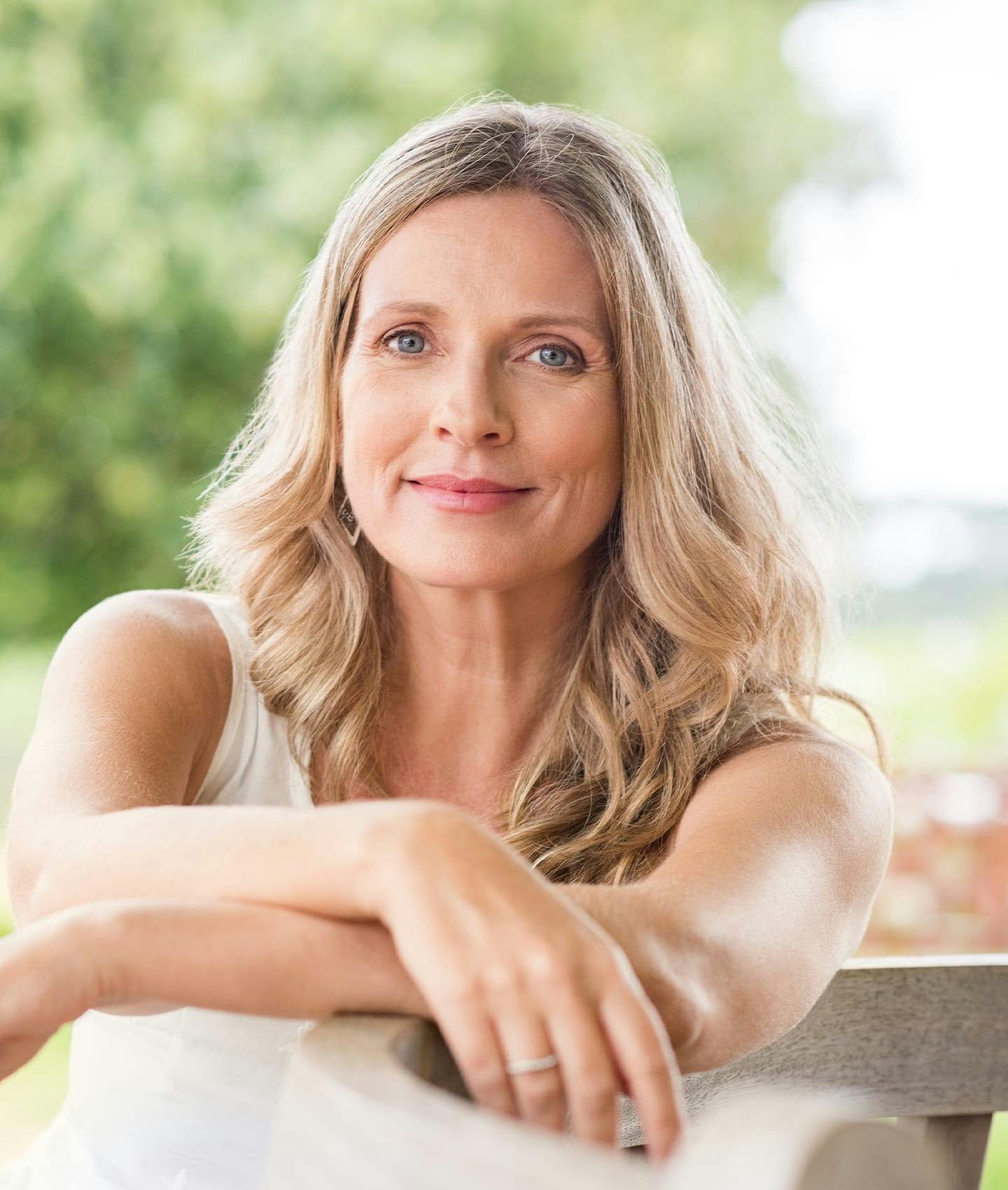 woman resting arms on knees