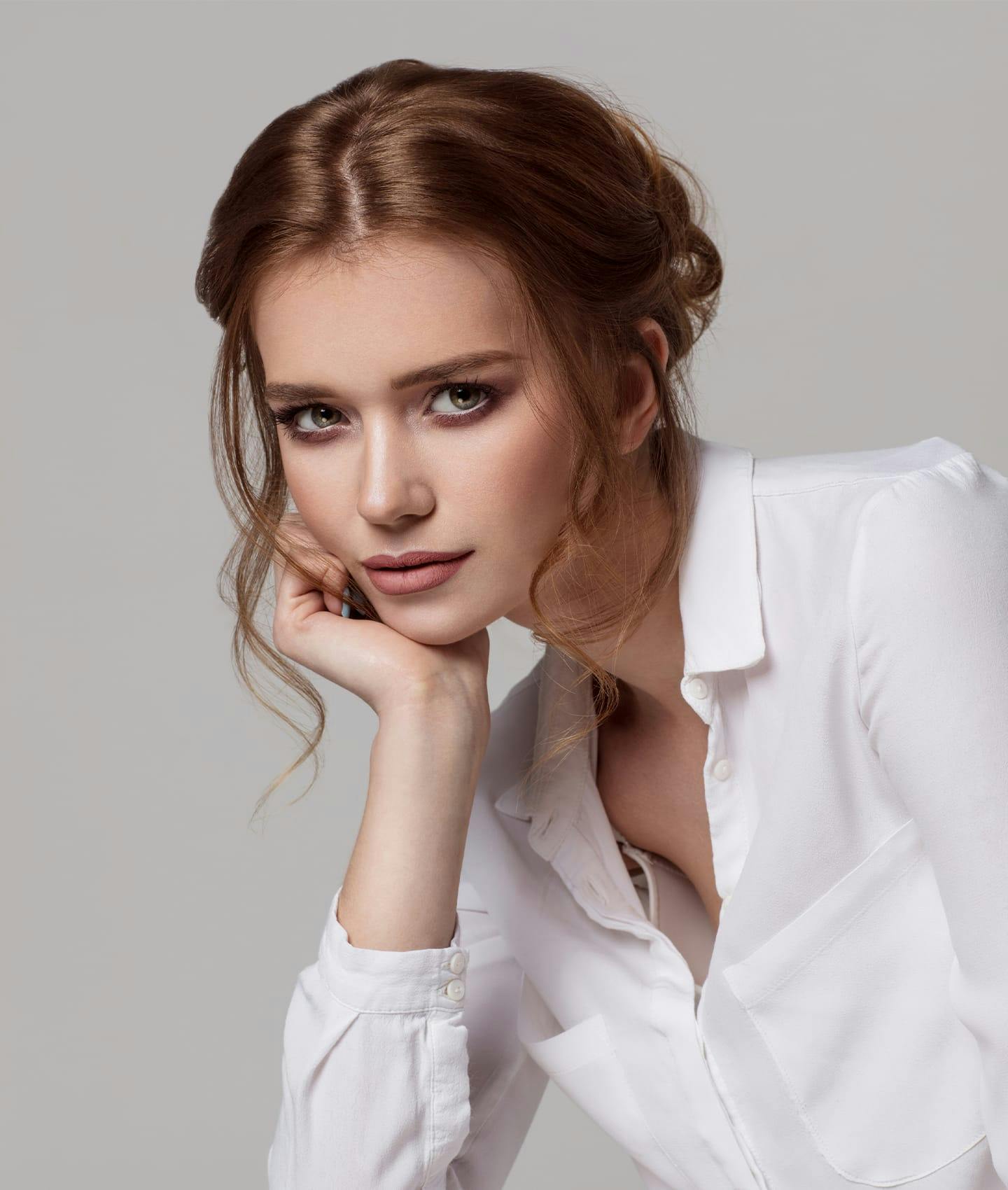 Woman posing with head in hand