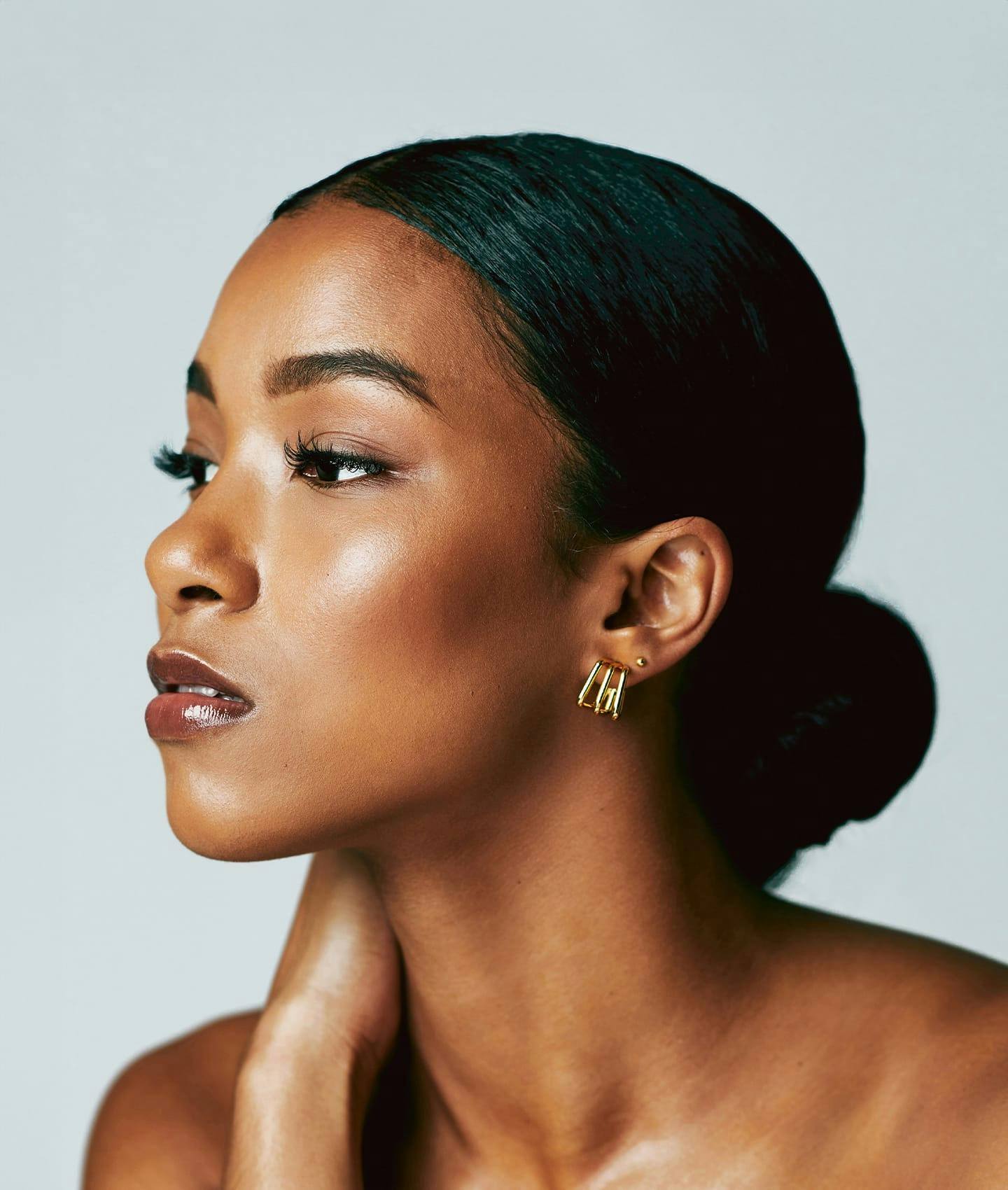 woman looking off with hand on shoulder