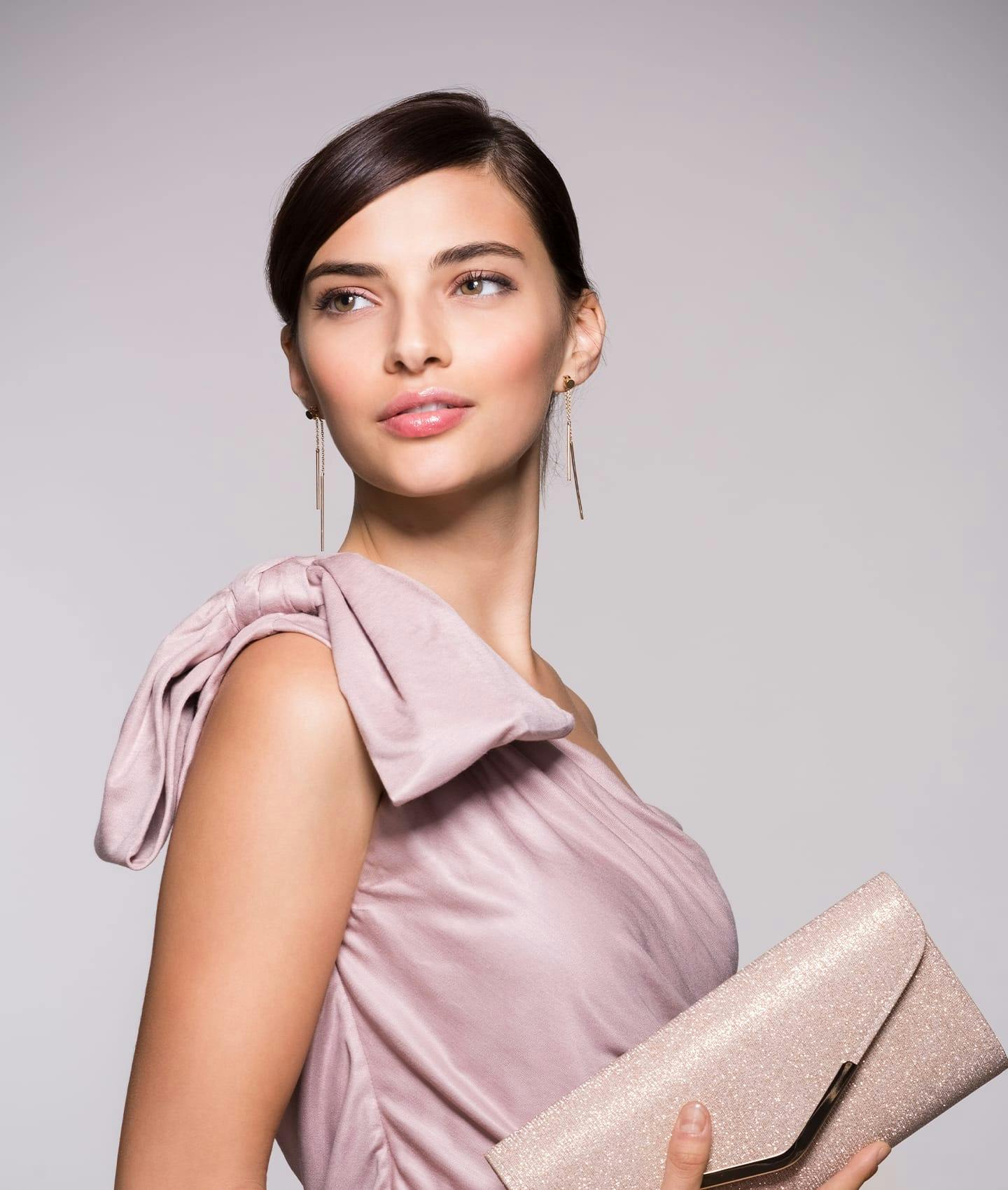 woman in designer dress looking over shoulder