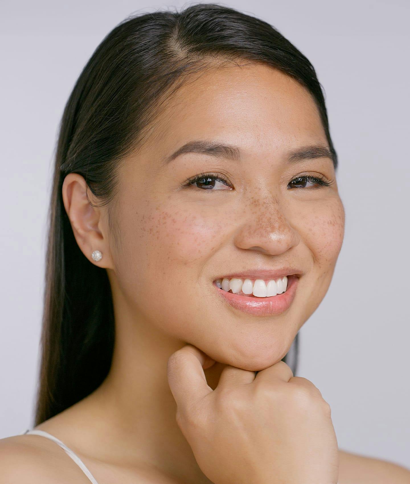 woman resting chin on hand