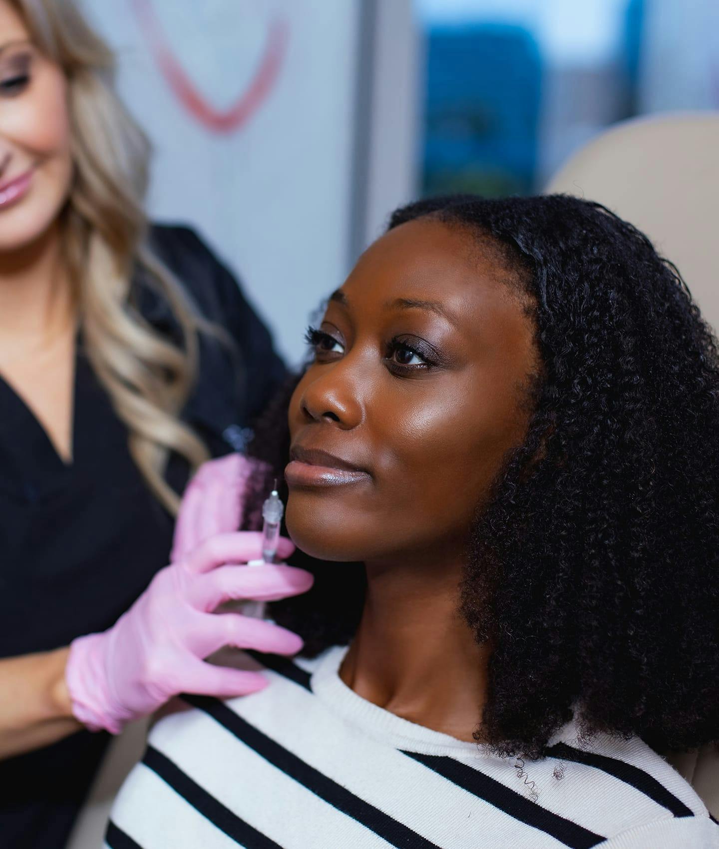 woman receiving facial injection