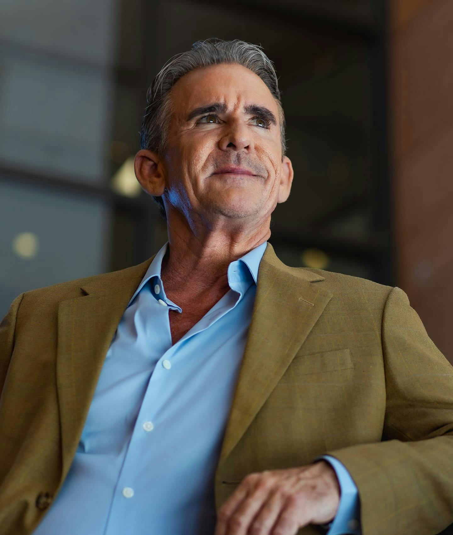 man in blue shirt and jacket