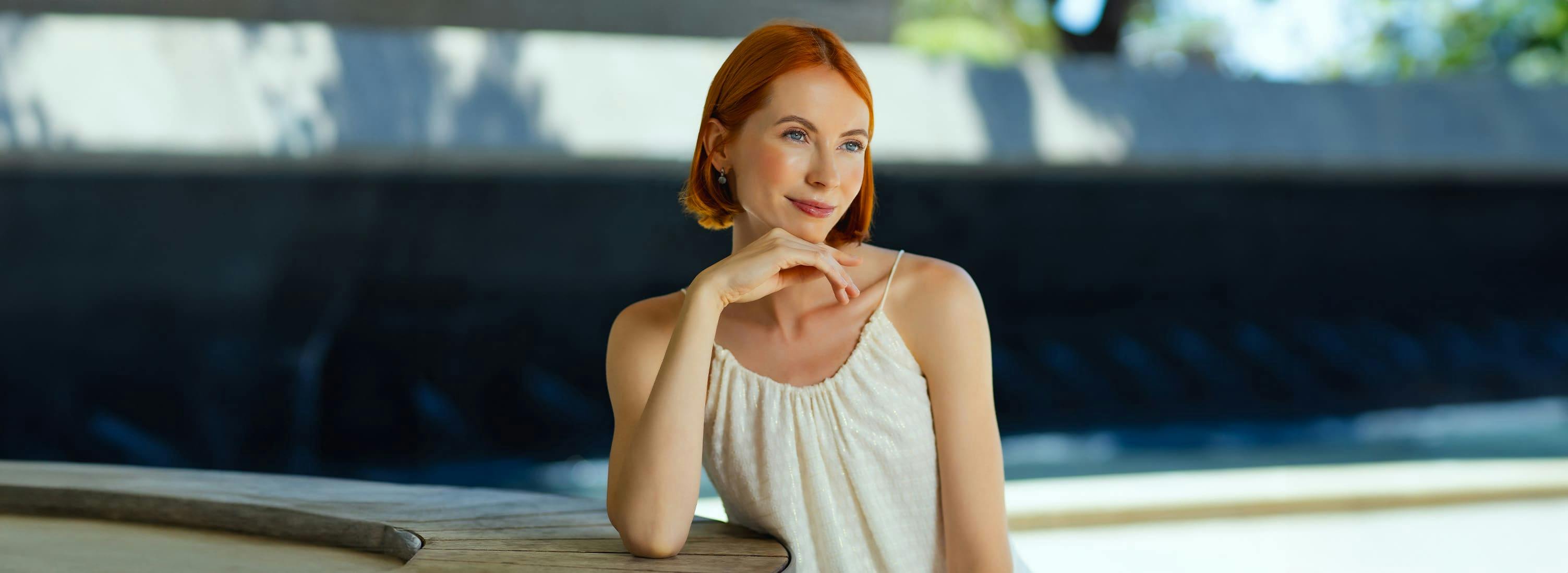 Woman resting her face on her hand