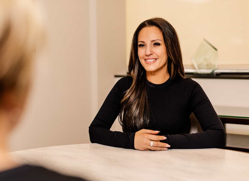 Woman sliming at table