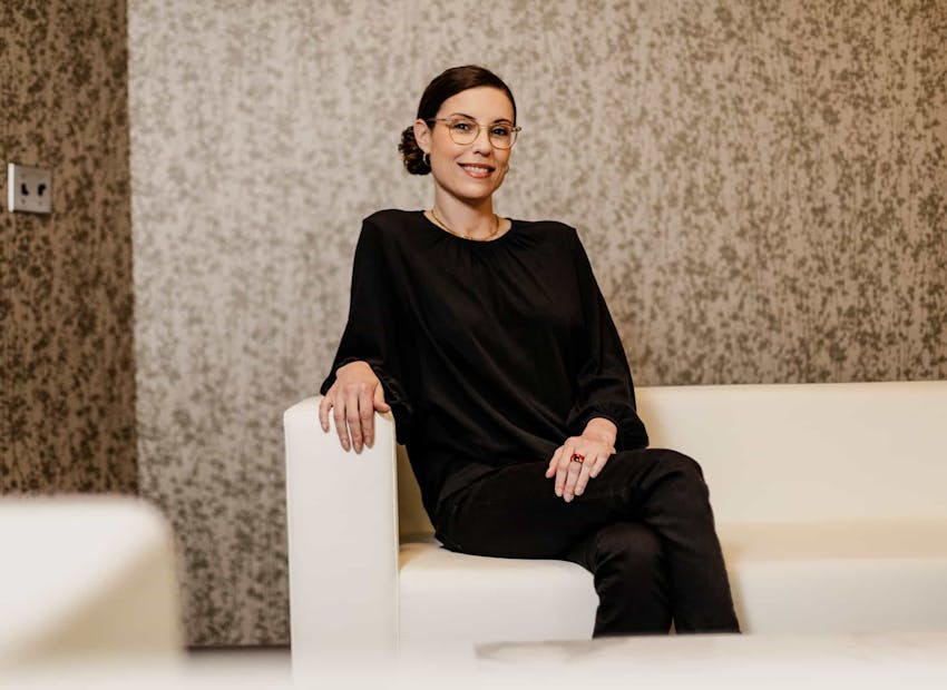 woman sitting and smiling