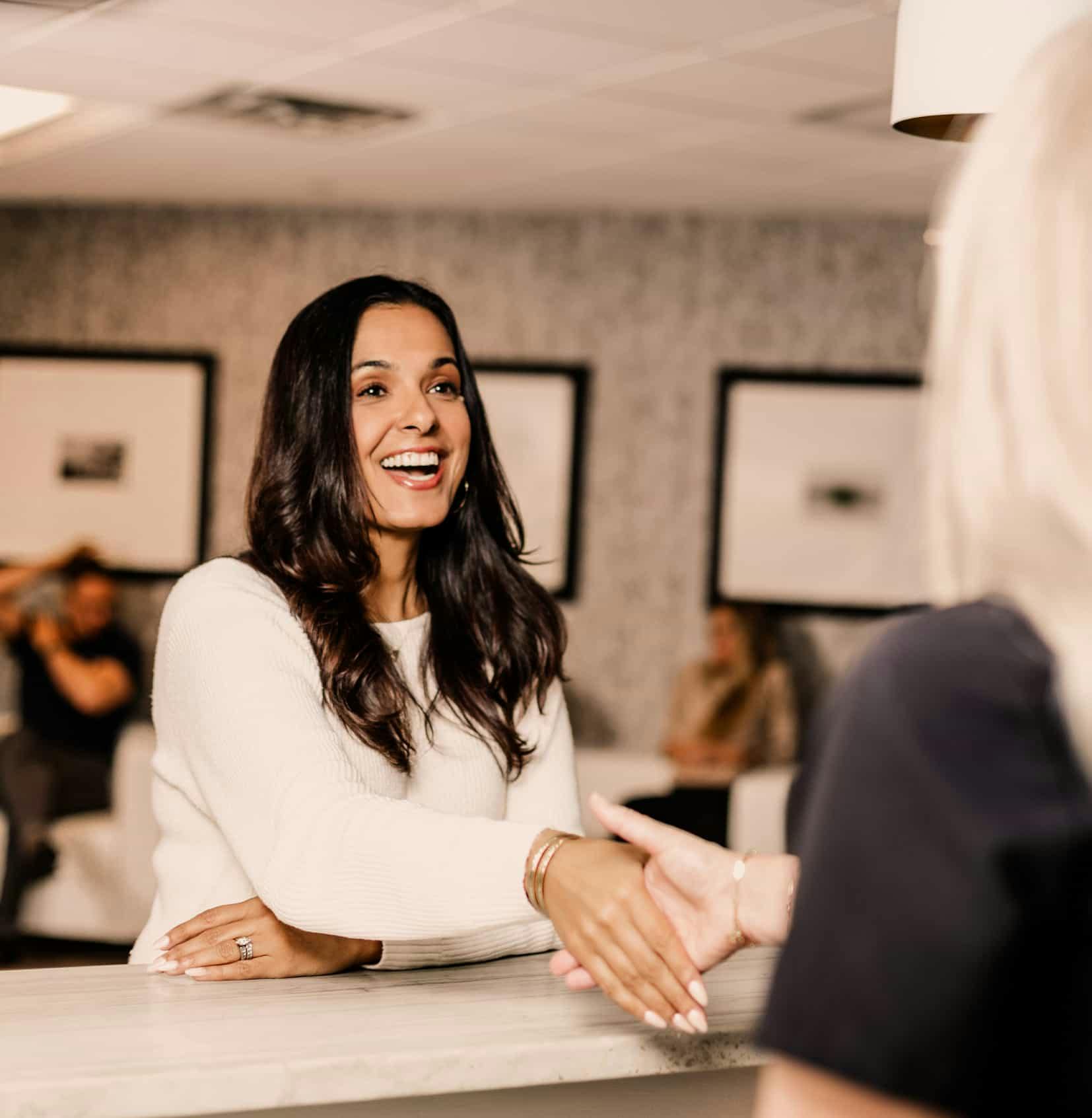 Woman smiling at front desk