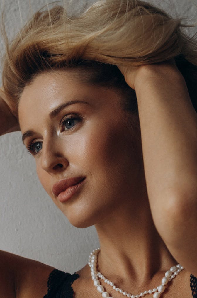 woman running her hands through her hair