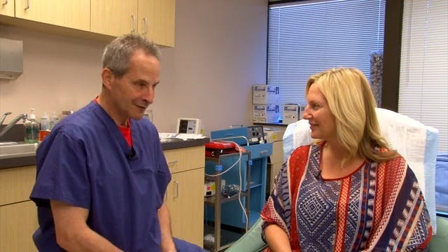 Dr. Wulc with a female patient