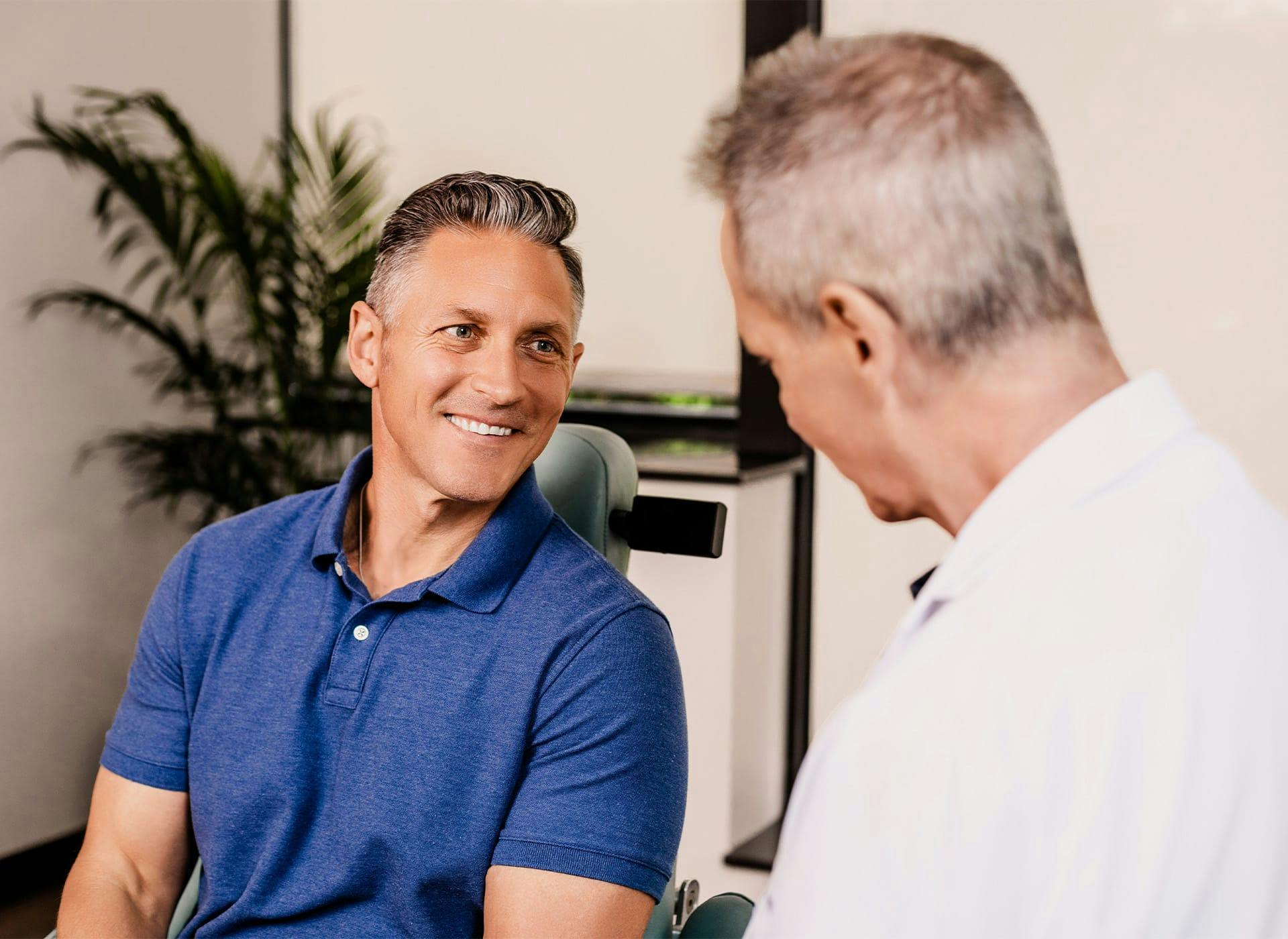 Doctor and male patient smiling
