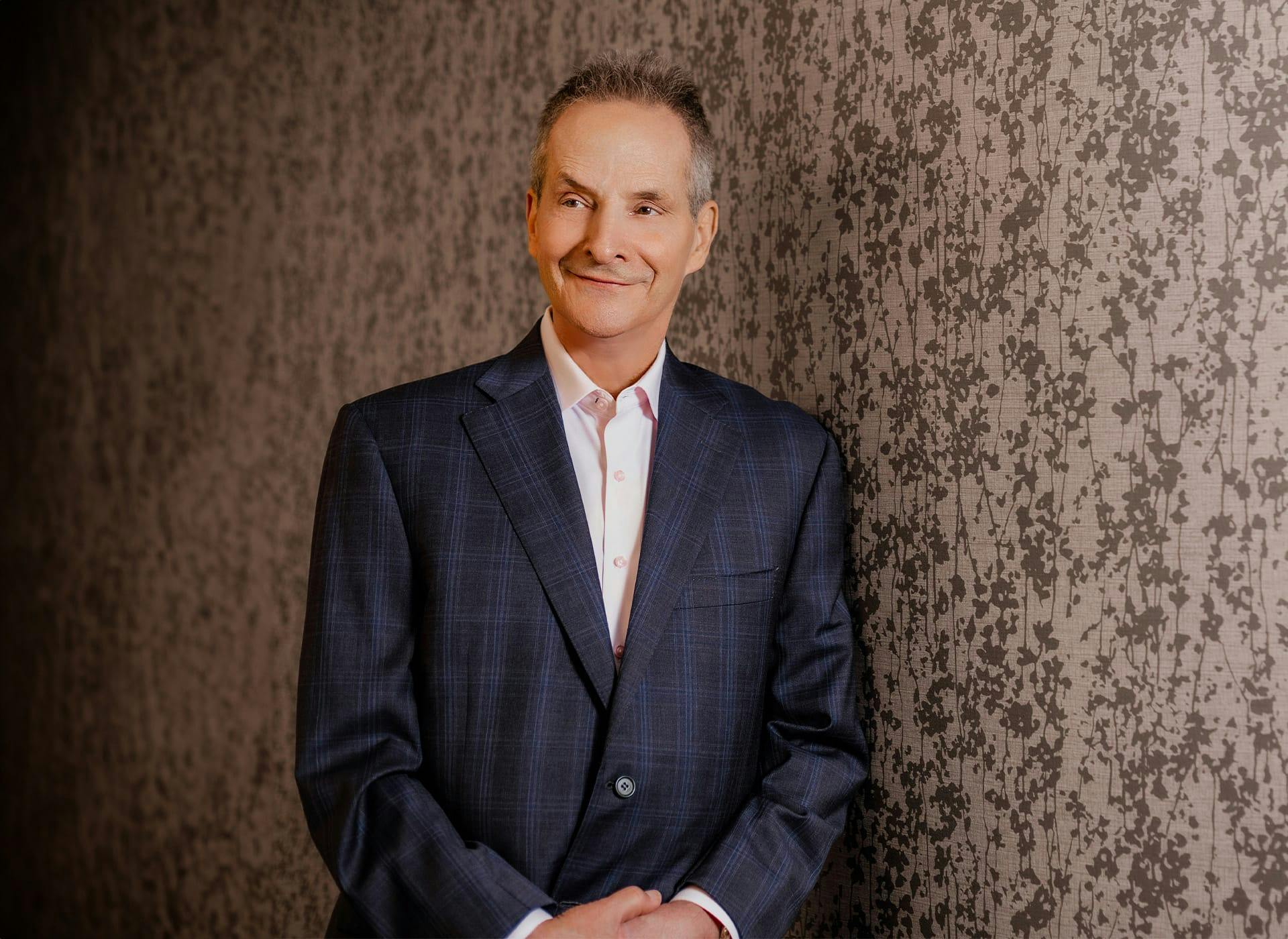 Dr. Wulc standing and smiling