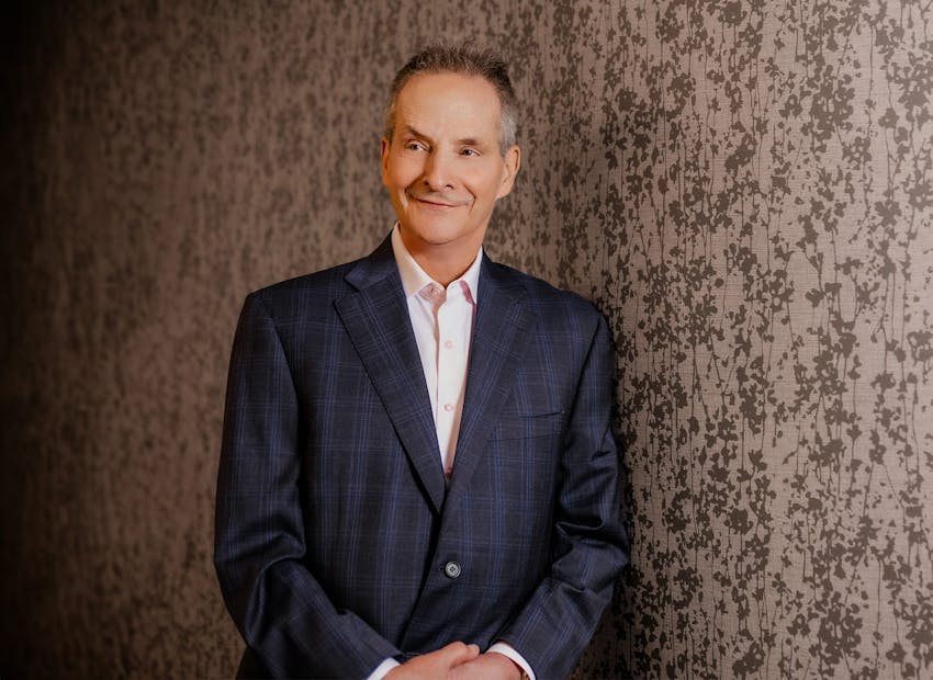 Dr. Wulc standing and smiling