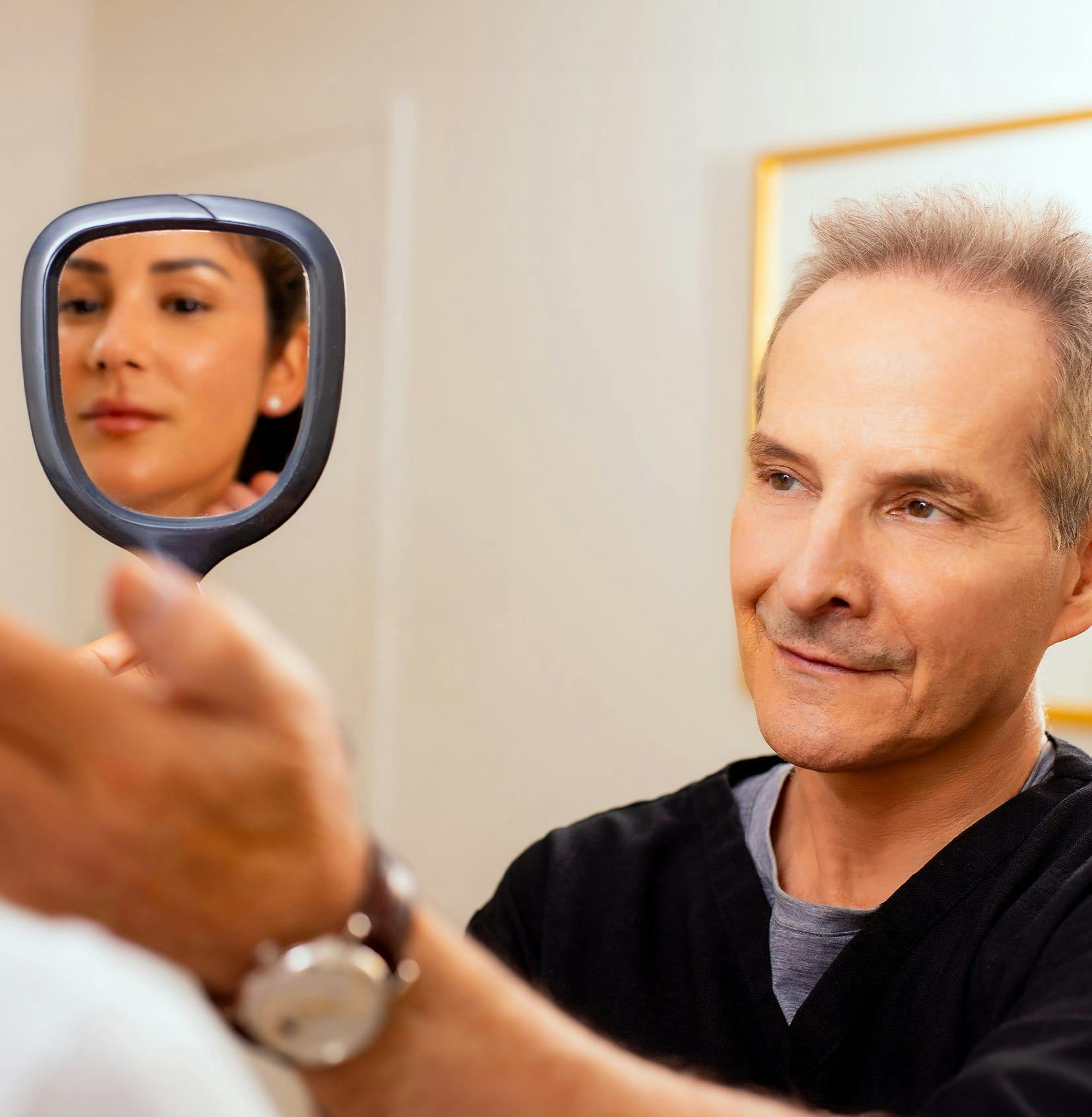 Doctor and patient with mirror
