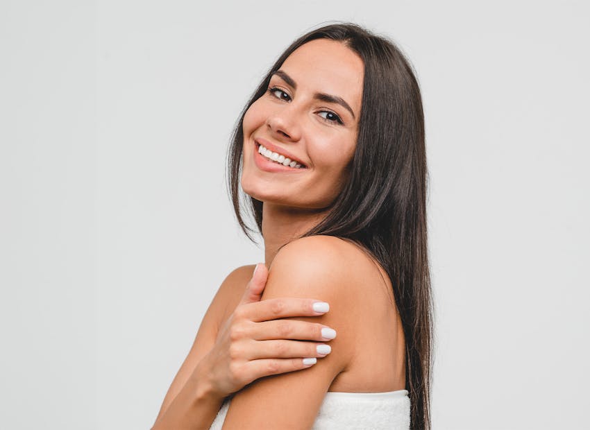 Woman touching her arm