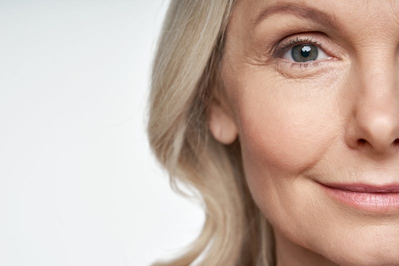 Half of an older blonde woman's face