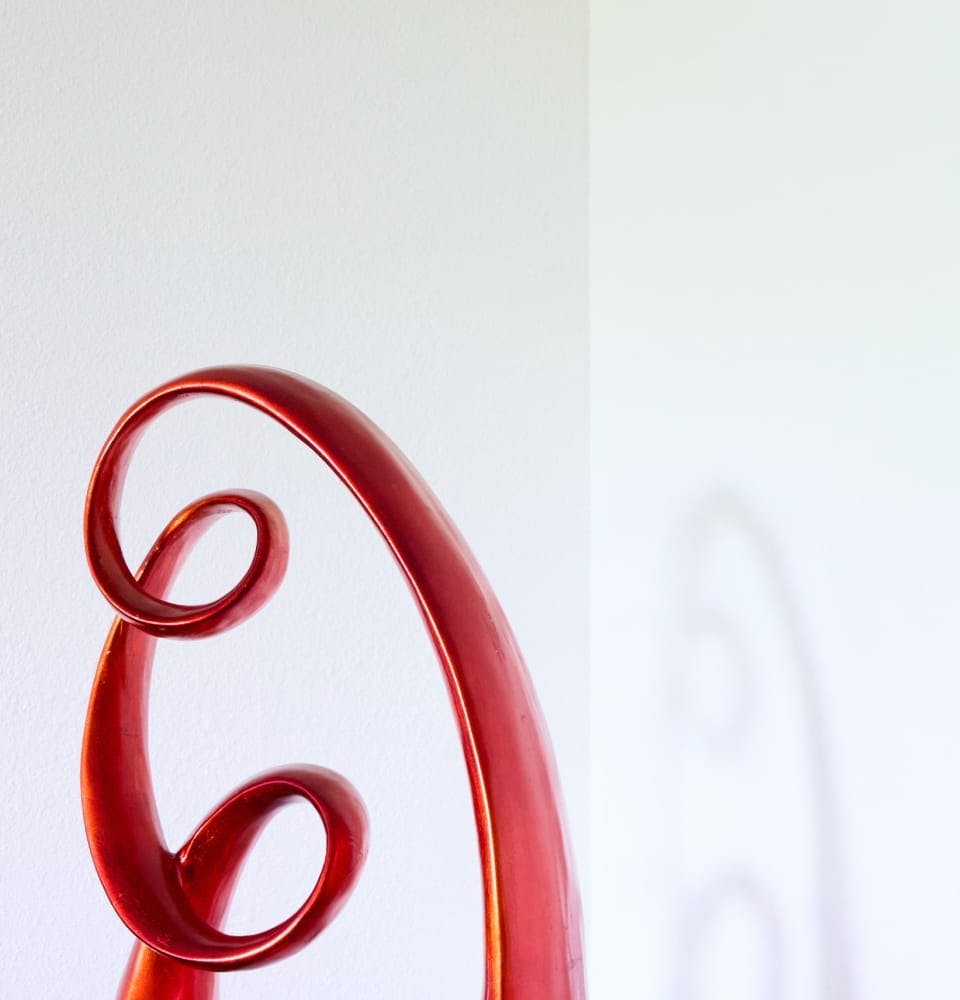 white background with red spiral decoration