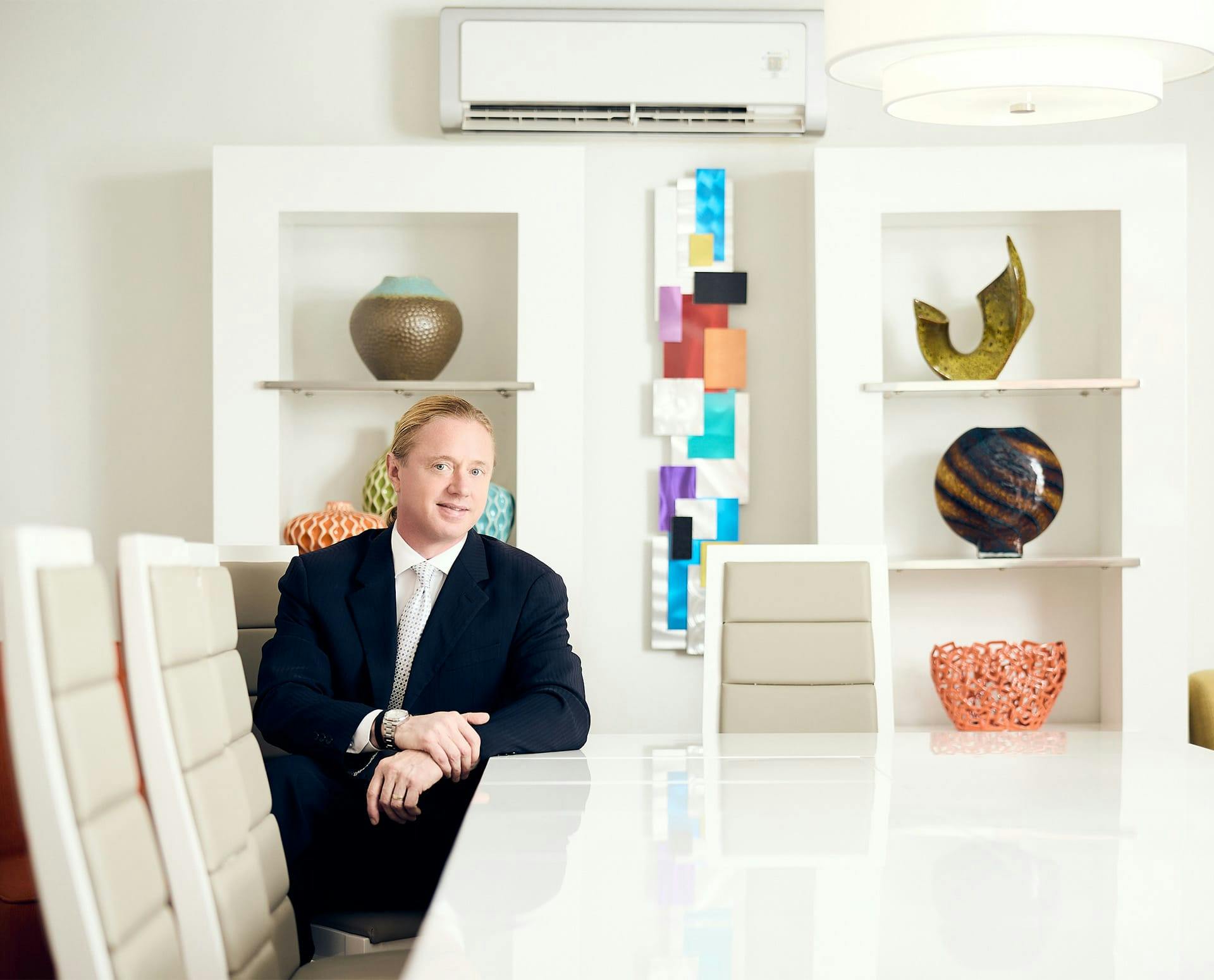 Tyler sitting at office table