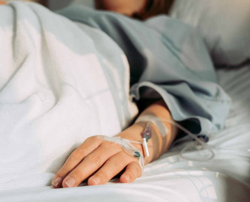 close up of IV in person's hand