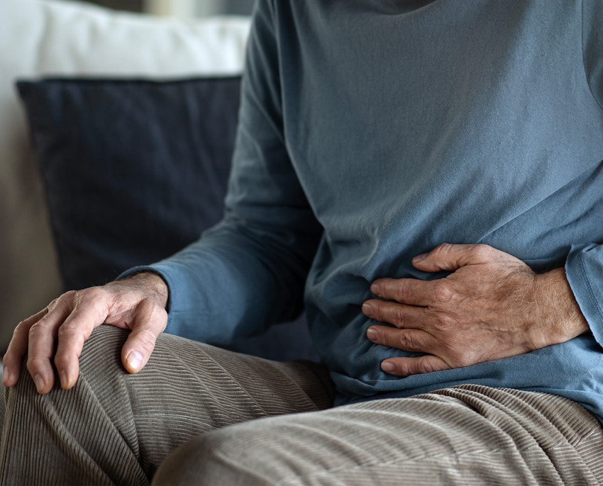 man holding his stomach