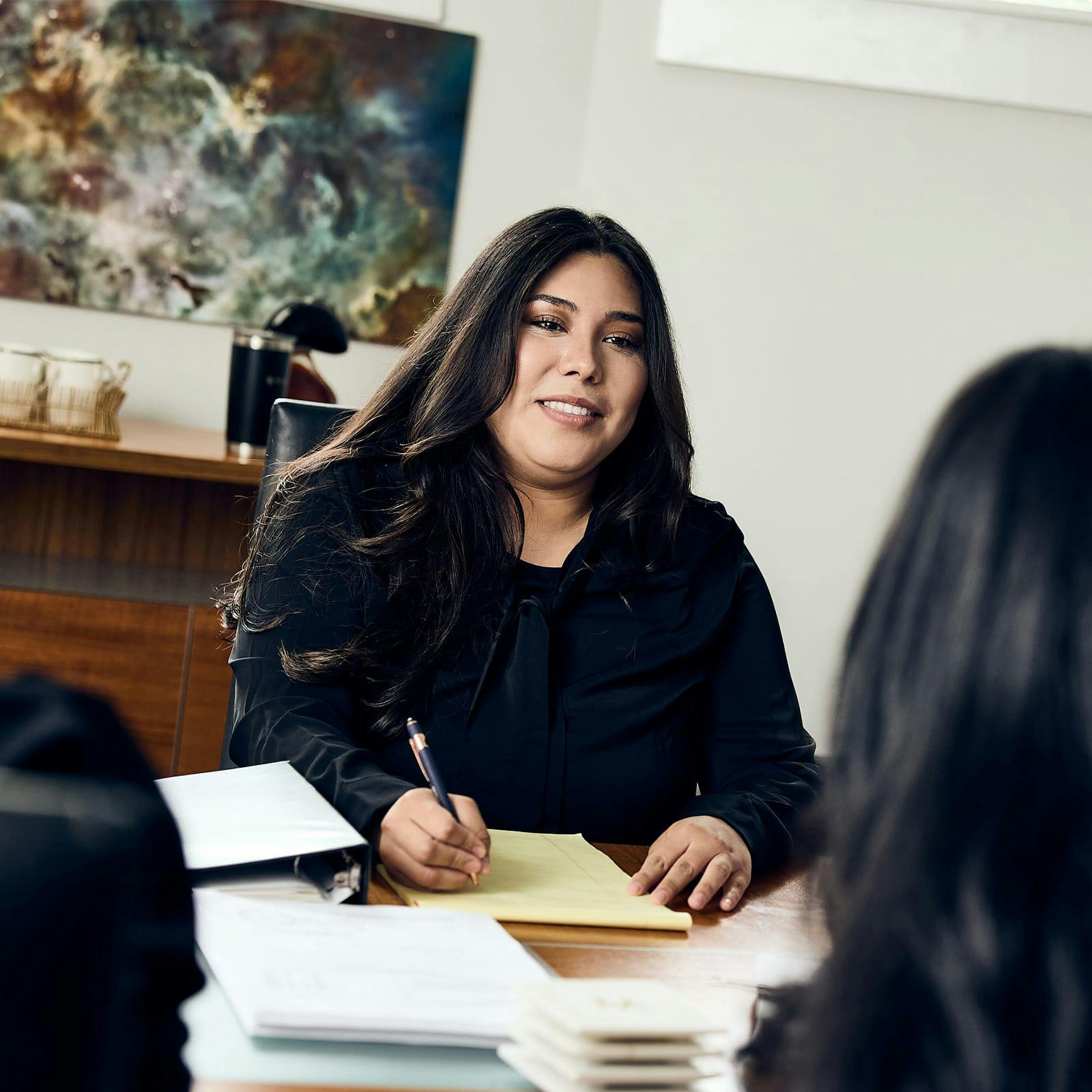 woman writing on note pad