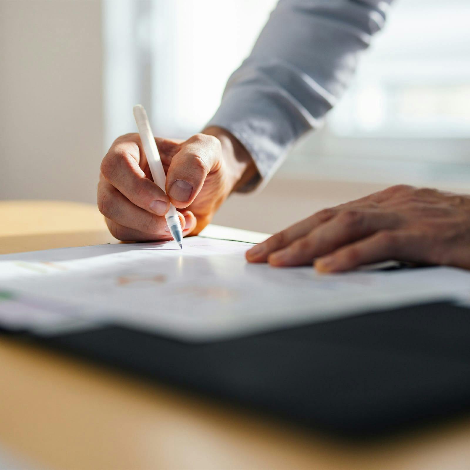 close up of person filling out form